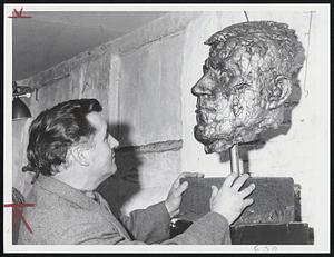 Sculpture and Sculptor stare at one another. Peter Abate, one of the 12-year-old New England Sculptors Assn., did this head of well-known artist Oskar Kokoshka.