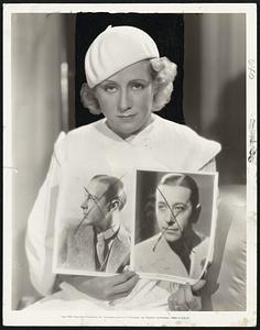 Is George Raft Valentino's Successor? -- Jean Acker, first wife of the lamented screen Sheik, says he is. Miss Acker, who returned to the screen for a role in Paramount's "Torch Singer", is shown here with photos of Valentino and Raft.