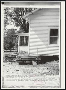 Flood Power--The power of floods is graphical illustrated in this photo from Massies Mill, one of the hardest-hit areas in Virginia. The rushing waters lifted this house from its foundations and deposited it atop a car.