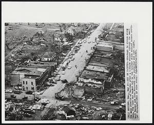 Hit by Twister--Wreckage is strewn along the main streets of Meriden after a tornado whipped through the small town. The town was hardest hit by the twister which skipped across northeast Kansas and into Missouri late yesterday and last night.