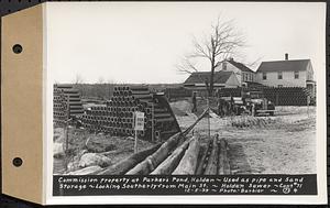 Contract No. 71, WPA Sewer Construction, Holden, commission property at Parker's Pond, Holden, used as pipe and sand storage, looking southerly from Main Street, Holden Sewer, Holden, Mass., Dec. 5, 1939