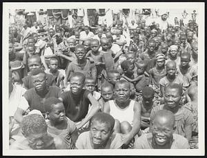 These are African Lepers. Shown at a Sunday church service is this congregation of lepers, members of the Bibanga Leper Camp in the Belgian Congo. The pastor, organist and choir leader are all lepers.