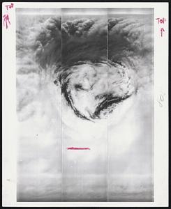 Film Strips from a U-2 flying "considerably above" 50,000 foot top of 1961 Hurricane Carla show the "eye" clearly. The cloud layers and counter clockwise motion are typical of tropical storms such as this. High "wall clouds" at top tower up into the stratosphere. Dark spots are the earth.