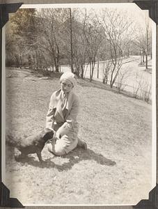 Olga Naoumoff sits by a Boston terrier