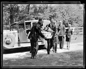 Pallbearers with coffin, Richard E. Byrd in the background