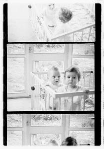 Two children in a playpen