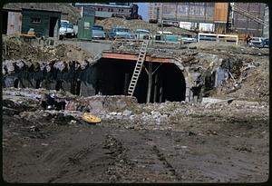 View of excavated construction site, includes tunnel entrance, Boston