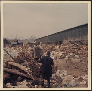 Men looking at flood damage