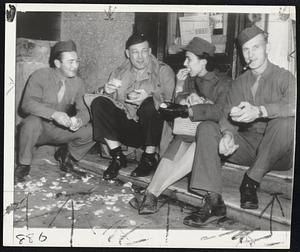 Sharkey Eats an Orange in Algiers-Jack Sharkey (second from left), former heavyweight boxing champion of the world, who is now entertaining United States troops in North Africa, samples some Algerian oranges with Pvt. Eddie Kotowski (left), Jamaica, L. I.; Technician Fifth Grade Vera Meyers, East Flatbush, Brooklyn, N. Y., and Pvt. Ted Rybicki of Lackawanna, N. Y.