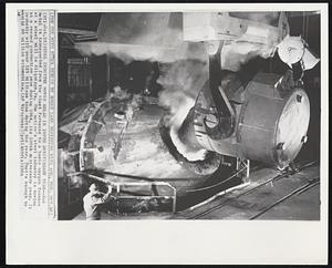 Steel Industry Moves Ahead In 100th Anniversary Year--Hot metal is transported from the blast furnace to a basic oxygen furnace at a steel mill in Aliquippa, Pa. The nation’s steel industry is moving at a record production pace during 1964, its 100th anniversary year. It probably will pour 125 millions tons during the year. That’s enough to build 60 million automobiles.