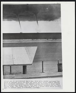 Twin Water Spouts performed for about 15 minutes about one mile off shore early (8/23) before leaving in a southerly direction. The weather bureau described a water spout as a tornado over water smaller then land formed tornados and not lasting as long. The funnel suck up water in a column which falls quickly once it touches land.