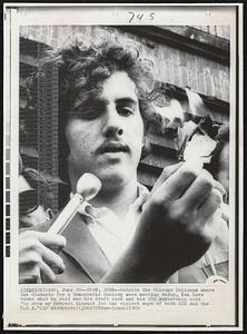 Burn, Burn--Outside the Chicago Coliseum where the Students for a Democratic Society were meeting today, Ken Love burns what he said was his draft card and his SDS membership card "to show my deepest disgust for the violent ways of both SDS and the U.S.A."