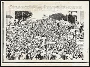 Anti-War Protestors March in Austin-- A crowd of marchers , estimated by police at more than ten thousand persons, march through downtown Austin Friday protesting the spreading of the war into Cambodia. The march started from the campus of the University of Texas and wound through the downtown area.
