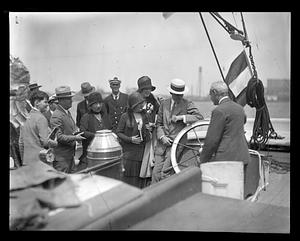 Mr. and Mrs. Henry Ford visit historic T-wharf to board Grenfell expedition schooner George B. Cluett off for Labrador