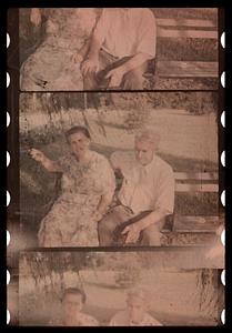 Two people seated on a bench