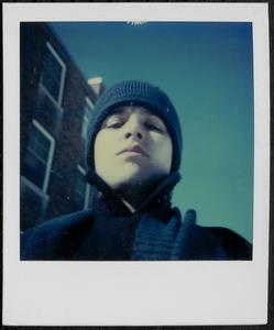 Close-up of a boy wearing winter hat