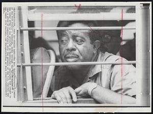 Behind Bars--The Rev. Ralph Abernathy, leader of the Poor People’s Campaign, looks through the barred window of a bus today after he was arrested in Washington. Abernathy had sought to lead a group of demonstrators onto the grounds of the U.S. Capitol and was taken into custody.