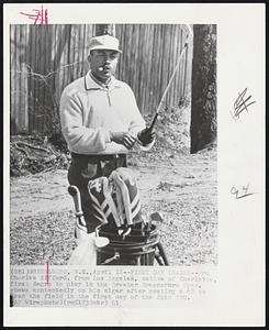 First Day Leader--Pro Charles Sifford, from Los Angeles, native of Charlotte, first Negro to play in the Greater Greensboro Open, chews contentedly on his cigar after posting a 68 to lead the field in the first day of the 24th GGO.