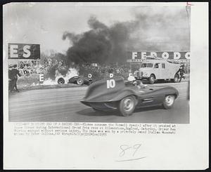 Fiery End of a Racing Car--Flames consume the Vanwall Special after it crashed at Copse Corner during International Grand Prix race at Silverstone,England, Saturday. Driver Ken Wharton escaped without serious injury. The race was won by a privately owned Italian Maserati driven by Peter Collins.