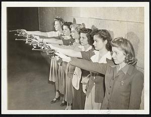 Pistols Not Pencils The Federal Bureau of Investigation Recreation Association which has a membership of several hundred girl secretaries and clerks is adept with a pencil and a pistol. For the girls, after a day's work of pounding a typewriter, relax at the FBI shooting range with pistols. They use .22 calibre revolvers mounted on the club was formed four years ago. In this photo members of the Pistol Club are shown on the range.