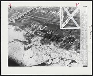 Jammed With Ice -- The Columbia water works (center) is jammed with pack ice on the river side and open water on the land side. Cottages are under water with townspeople standing on the banks looking at the damage. The Columbia-Wrightsville bridge is shown at top left.