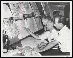 Menacing Weather Fronts studied at Weather Bureau at Airport. From left, Albert Flahive, forecaster; William Drebert, guidance forecaster; Anthony Gregory, public service forecaster.