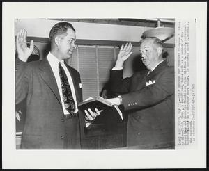 Adams Becomes Sec Member- Clarence H. Adams of Bloomfield, Conn., a republican, takes oath as a member of the Securities and Exchange Commission from William E. Becker, personnel director (left) in a ceremony here today. He succeeds Harry A. McDonald, who resigned.