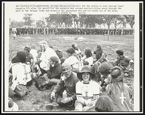 Antiwar demonstrators wait for the police to move through their campsite 5/2 after the permit for the campsite was revoked earlier. Police swept through the park on the Potomac River and arrested the protesters who had not moved out of the area.