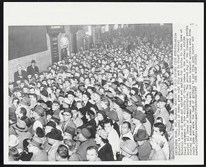 Mass Meeting of Cold Supper Club Members -- While dinners in thousands of homes grew cold this mob in Grand Central Terminal grew and waited for trains to take them at least somewhere in the vicinity of their homes as the subway strike snarled all forms of transportation. The second day of the runaway strike started by subway motormen took more and more transit workers away from their jobs and made the task of getting to and from work harder and harder.