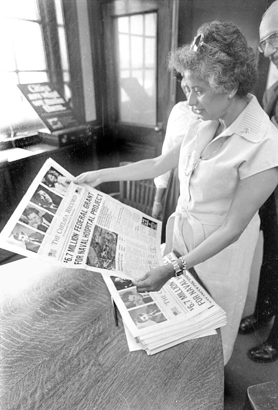 Secretary Harris reading the Record