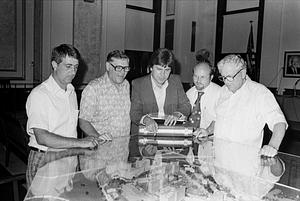 City Officials Guy Santagate, unknown, Richie Clayman, Ted Smigielski, Davy Newman review Naval Hospital site model