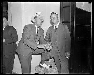 Two unidentified men smoking