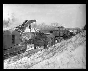 People looking at damage of a train accident