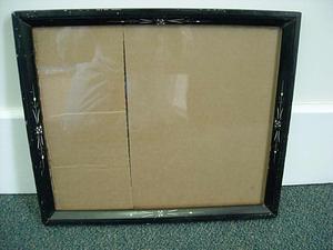 Ebonized rectangular frame with ivory or mother-of-pearl