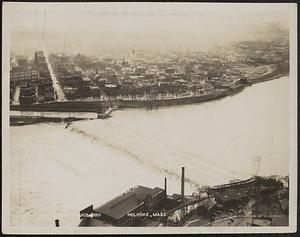 Aerial shot of floodwaters cresting over the Holyoke Dam