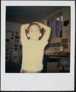 Boy with his hands on his head