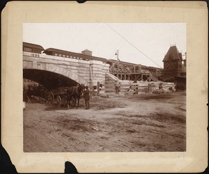 Railroad during construction with train at depot