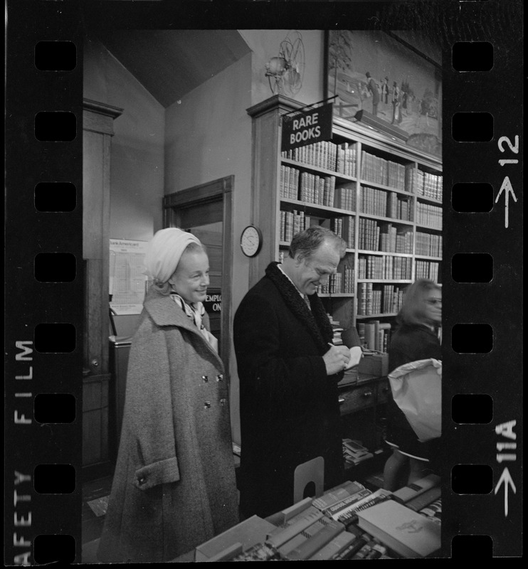 Famed comedian Red Skelton takes time to do some shopping in a book store at Kingston and Bedford Sts.