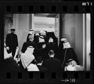 Men wearing bisht over thawb entering the Sheraton ballroom