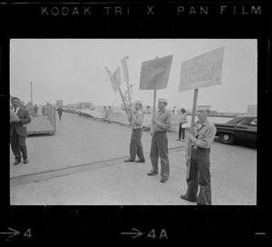 Sailors holding handmade signs