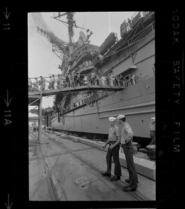 Men and women walking off ship