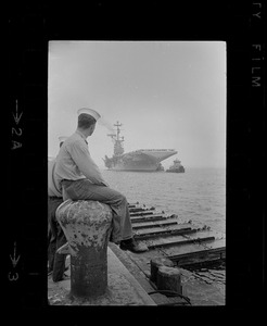 Sailors waiting on dock for USS Wasp to anchor