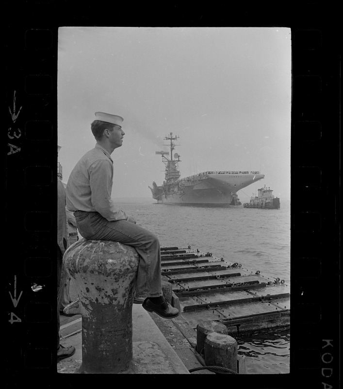 Sailor waiting on dock for USS Wasp to anchor