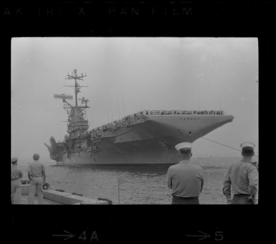 Sailors waiting on dock for USS Wasp to anchor