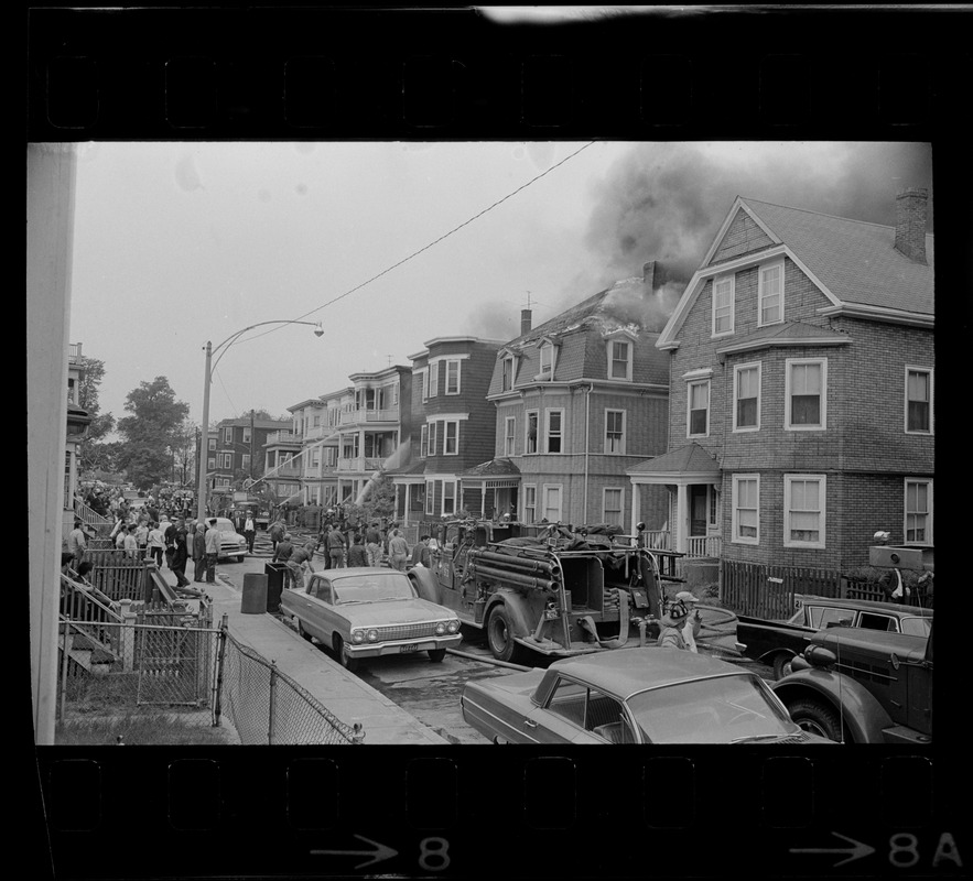 Firemen putting out house fires on Bellflower Street