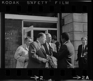 Mayor Kevin White and Hale Champion, BRA administrator, being interviewed outside of Boston Redevelopment Authority South End office during BRA sit-in