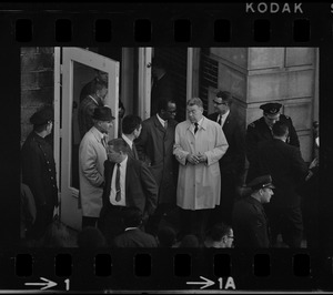 City councilor Thomas I. Atkins speaking with Superintendent Herbert F. Mulloney outside of Boston Redevelopment Authority South End office during sit-in