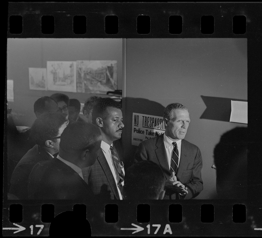 Mayor White and another man surrounded by a crowd during BRA sit-in