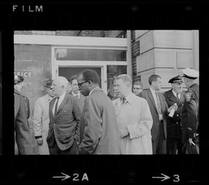 City councilor Thomas I. Atkins, Superintendent Herbert F. Mulloney and others outside of Boston Redevelopment Authority South End office during sit-in