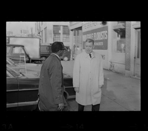 City councilor Thomas I. Atkins and Superintendent Herbert F. Mulloney outside Boston Redevelopment Authority South End office during sit-in